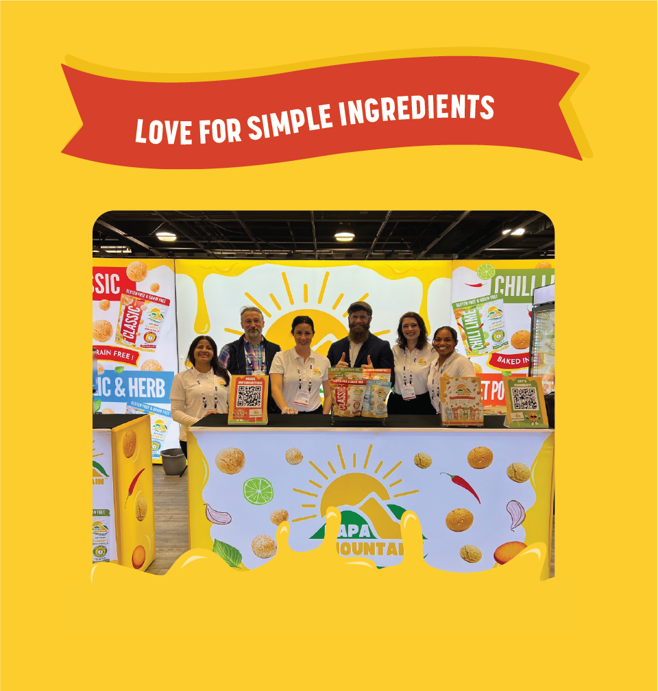 Papa Mountain booth at ExpoWest 2024, showcasing all-natural cheese bread rolls and clean-label food products, emphasizing the brand's commitment to growth, market expansion, and bringing wholesome meals to families nationwide